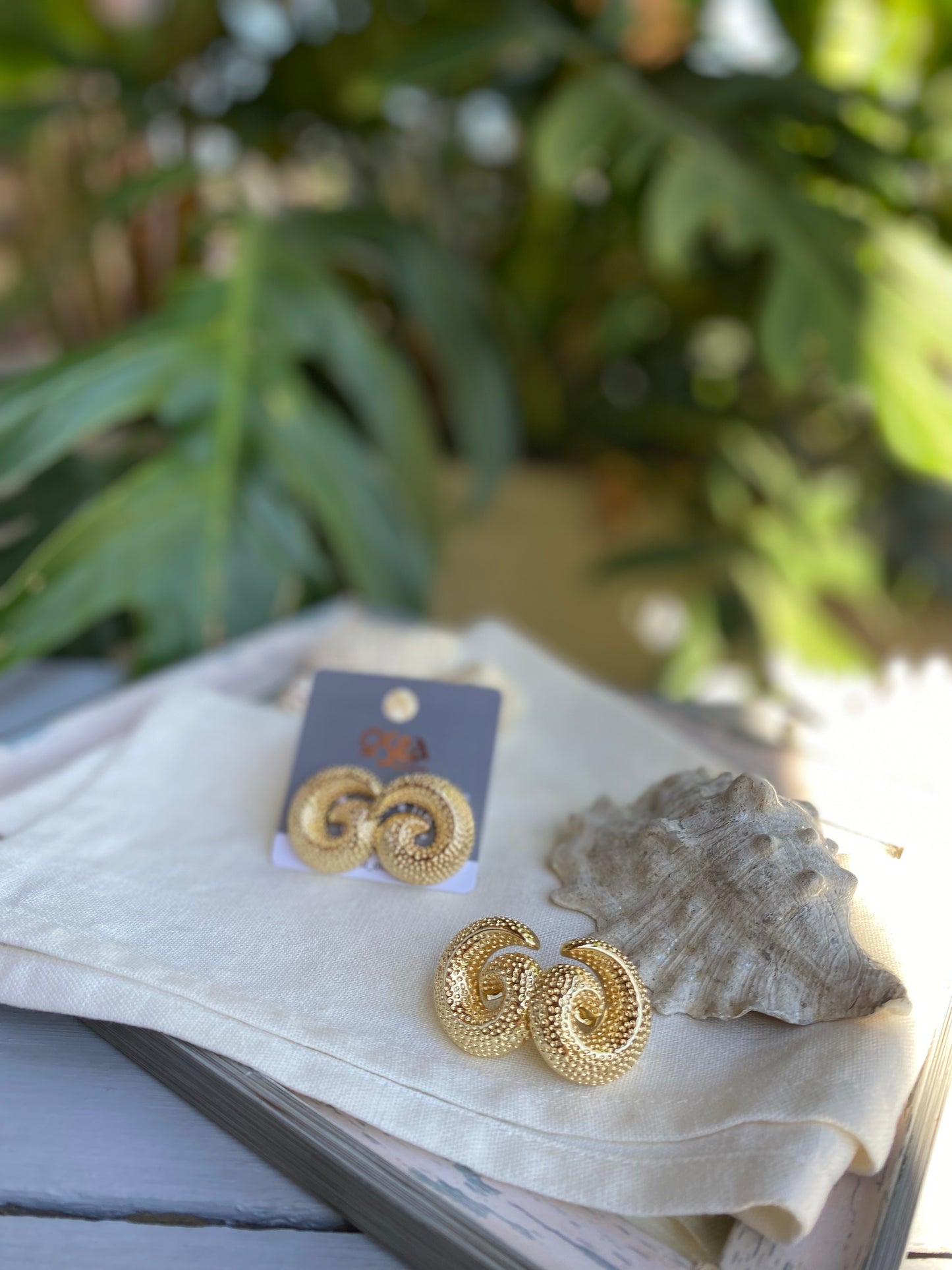 Topos caracol oro golfied con textura