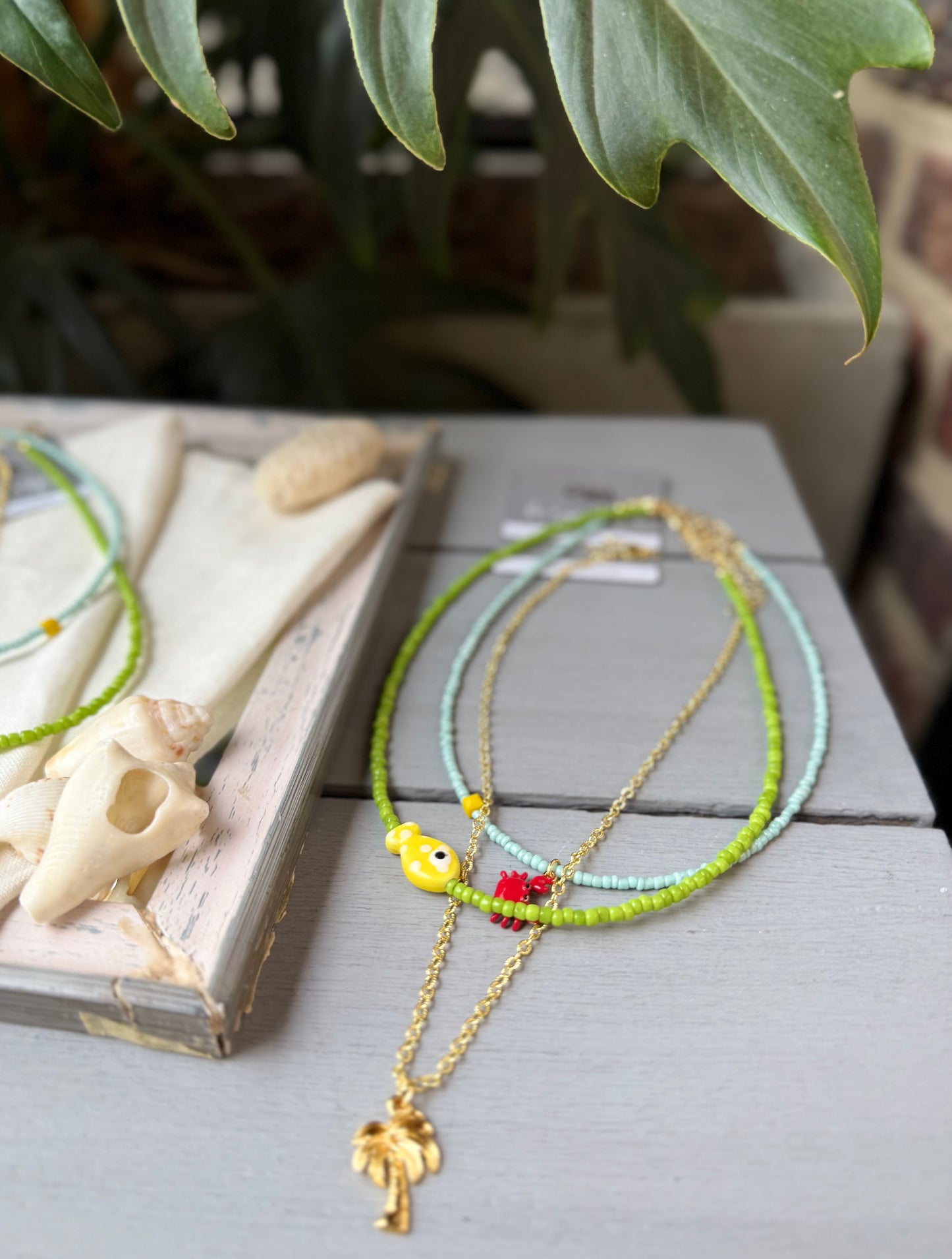 Collar triple palmera y pez