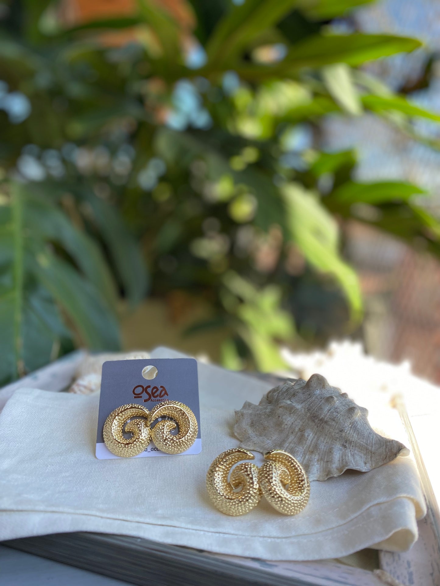 Topos caracol oro golfied con textura