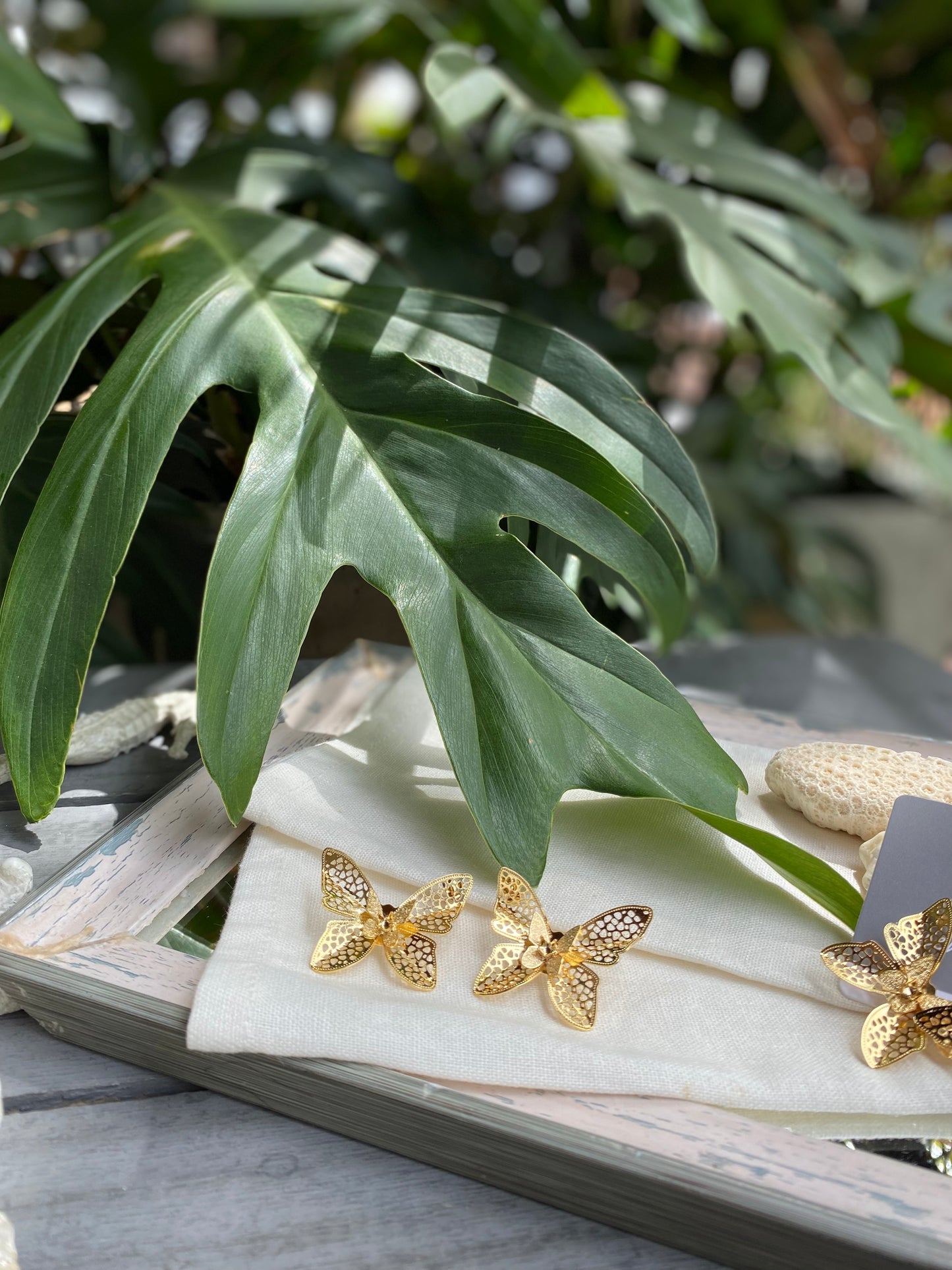 Topos mariposa doble en bronce