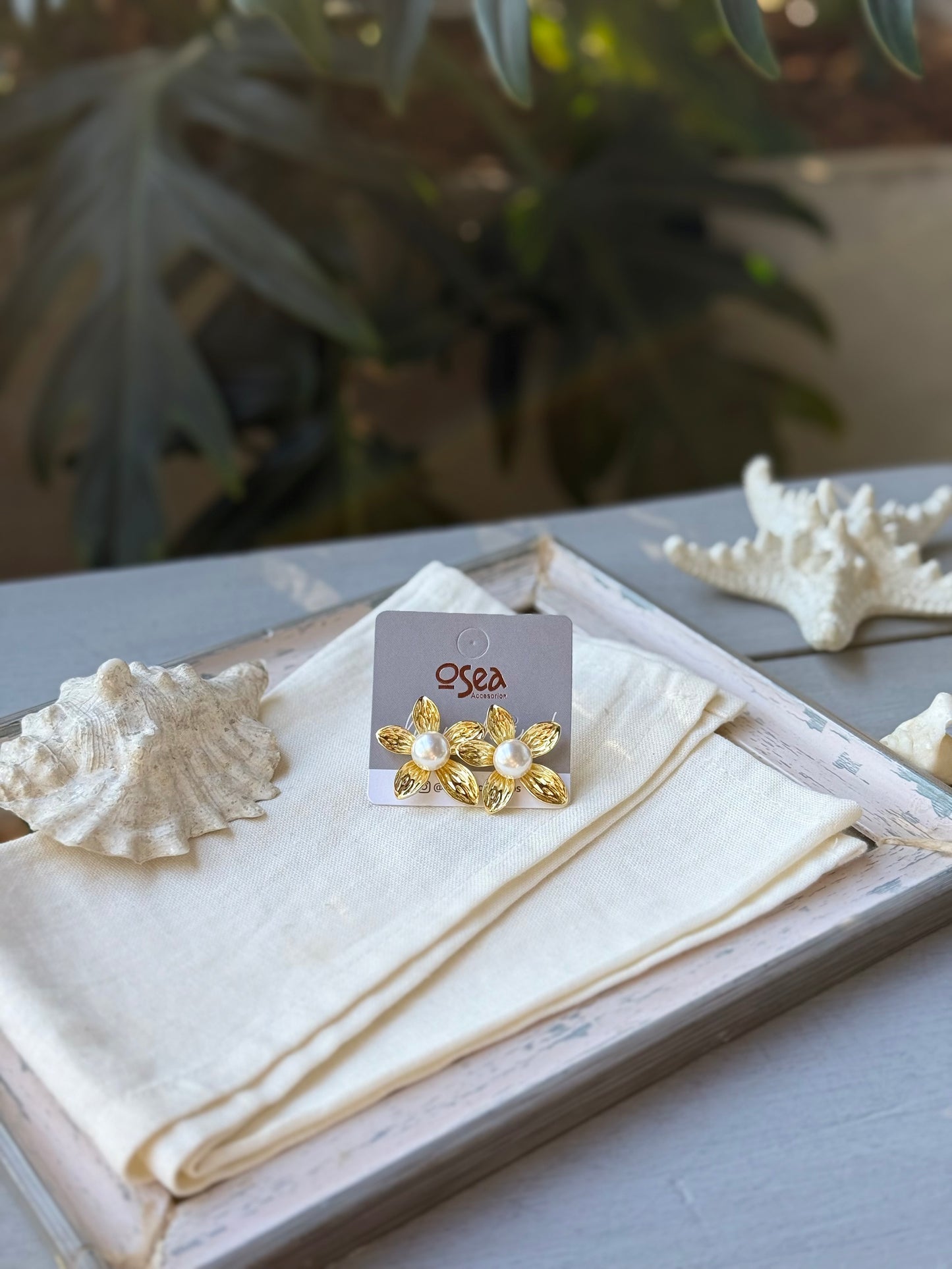 Topos rodinados de flor con perla