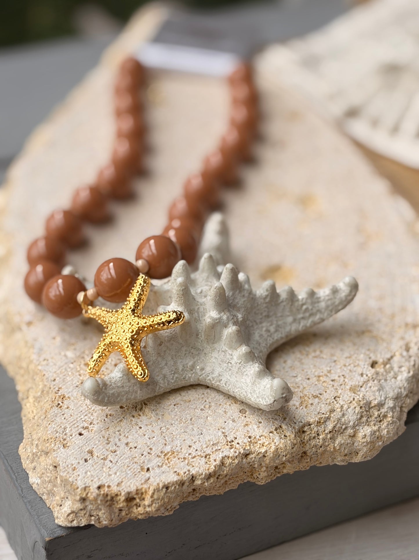 Collar bolas café dije estrella de mar