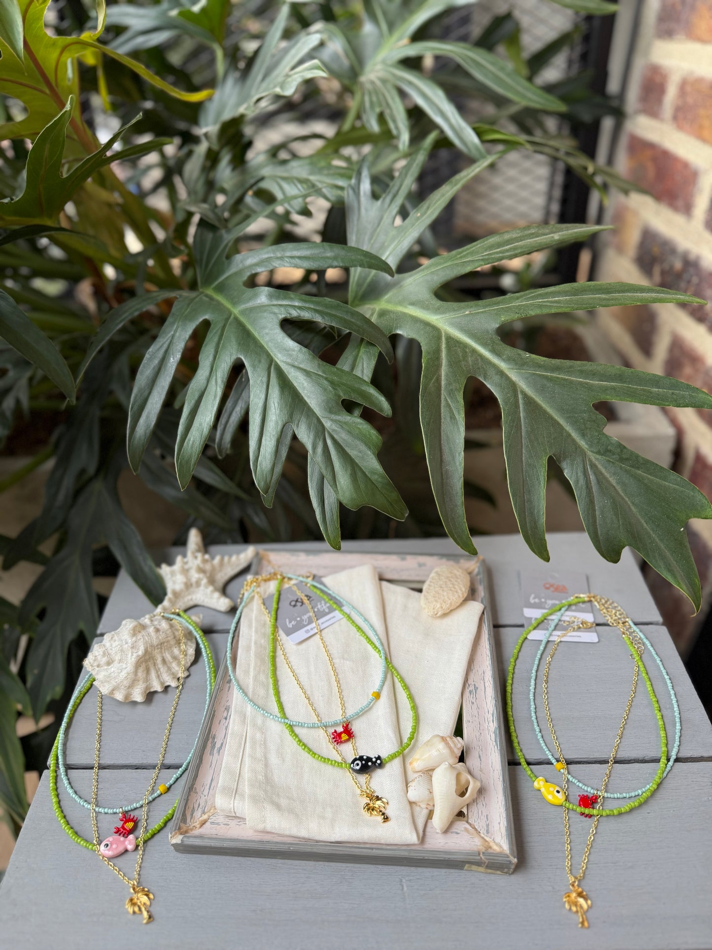 Collar triple palmera y pez