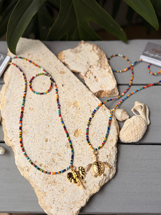 Collar largo mostacillas tuti dije tortuga o elefante