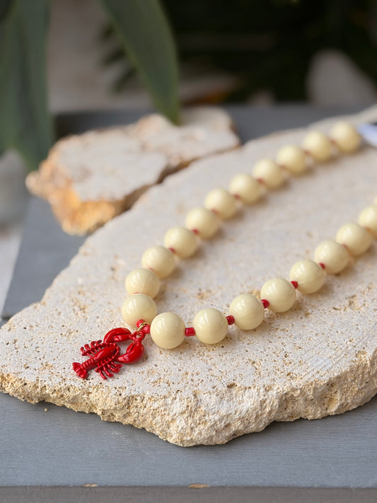 Collar bolas beige y mostacillas langosta roja