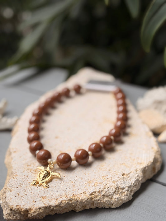 Collar bolas café dije tortuga de mar