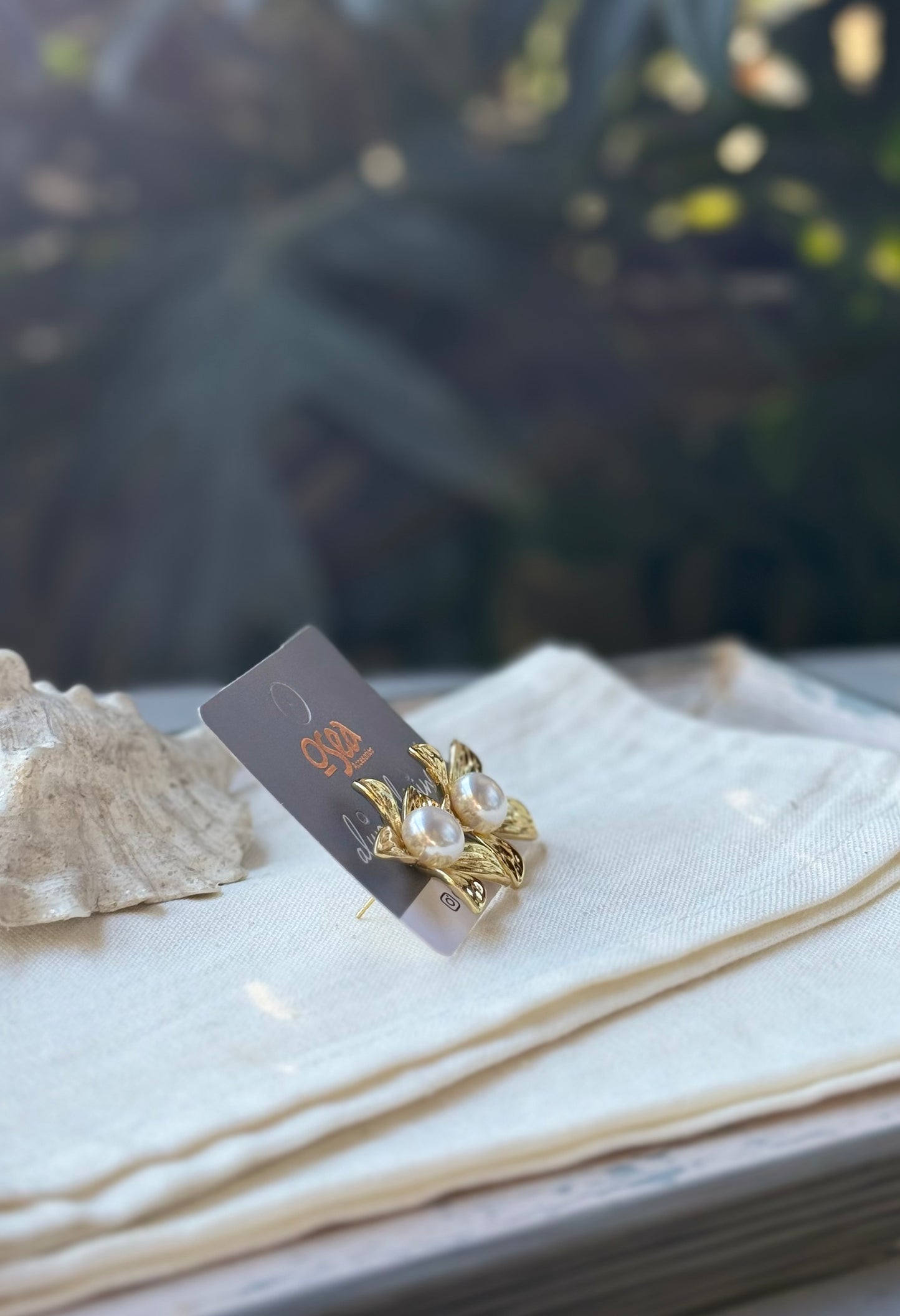 Topos rodinados de flor con perla