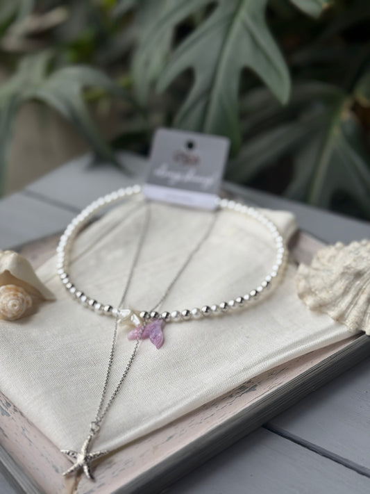 Collar doble en perlas y dijes de mar